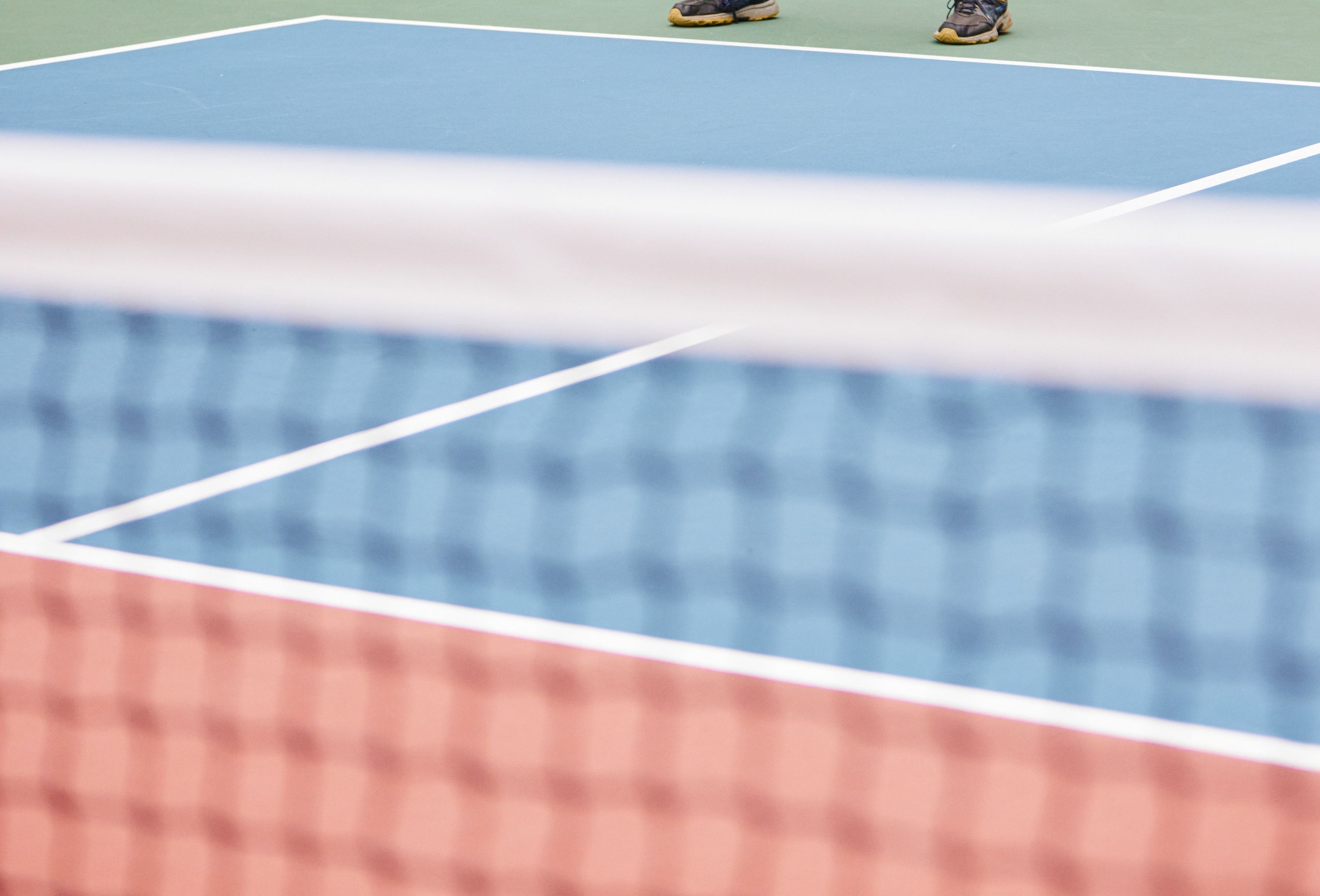 If you have a backyard court or slab you’d like to convert into a pickleball court, or need to add lines to an existing court near you, here are some DIY tips on how to tape a pickleball court.